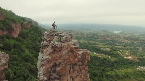 Drone of Young Free Climber and Hiker, Climbing Mountain Cliff