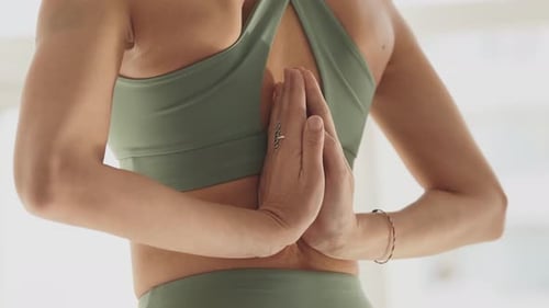 Woman Stretching with Hands Clasped Behind Back