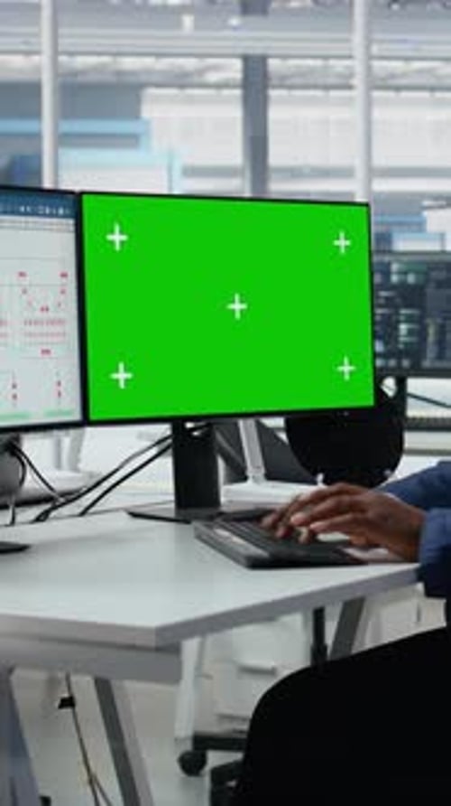 Vertical Video Green Screen Mockup PC Used By Man in Semiconductors Factory Office