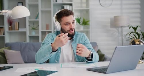 Young Adult Conferencing Online From Home Office