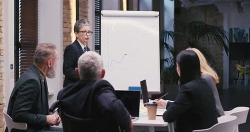 Business Team Brainstorming Data Strategy in Modern Office