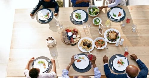 Family eating lunch, food and top view for thanksgiving with bonding, care or love for celebration