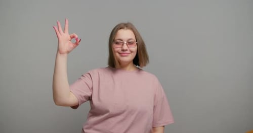 Woman Showing OK Hand Gesture