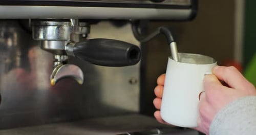 Steaming Milk With Coffee Machine in Close Up