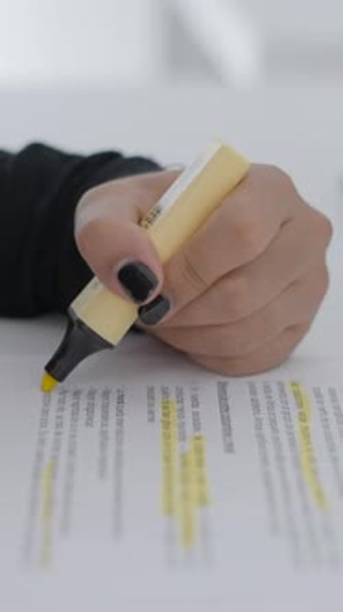 Close Up Shot of a Student of Colombian Universitary Highlighting Important Words and Sentences of