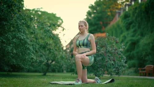 Young Woman Practicing Yoga and Stretching Fitness at Park Representation of Healthy Lifestyle and