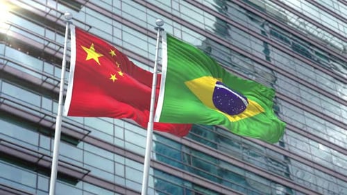 China and Brazil Flags Waving on Modern Corporate Building