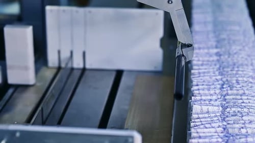 Mechanical packaging of diapersю A batch of diapers is packed on a special machine