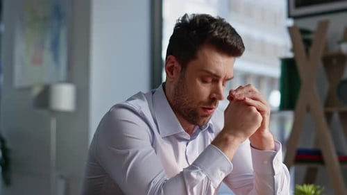 Exhausted Businessman Thinking Problem Holding Head at Office Workplace Closeup