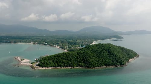 Lush Green Island with Rocky Coastline and Clear Waters Lipa Noi Ko Samui Thailand