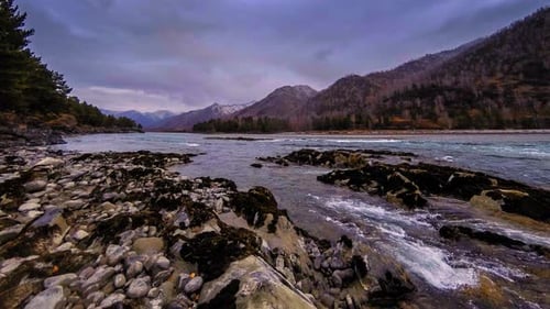 Time Lapse Shot of a River Near Mountain Forest Huge Rocks and Fast Clouds Movenings