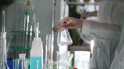 Scientist Works with Chemicals in Science Lab