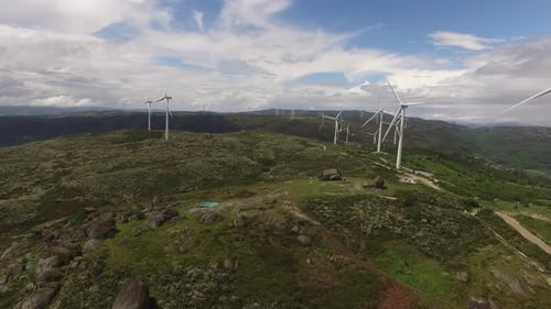 Aerial View of Wind Turbines or Windmills Farm Field in Industry Factory with Stunning Landscape