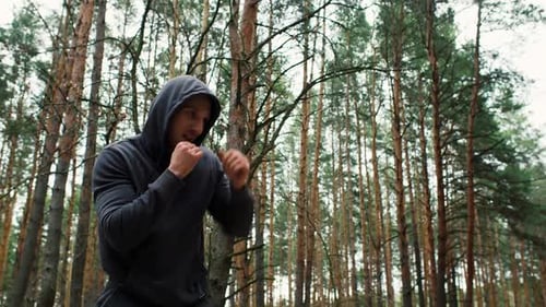 Boxer Man Traning in the Forest Shadow Boxing Boxer Jog Sport Motivation Outdoor Training