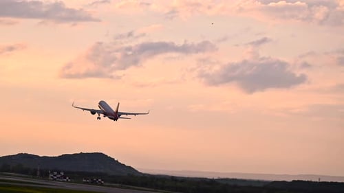 Huge Airplane Jet Take Off From Airport Landing Zone at Beautiful Sunset Clouds Sky Super Slow