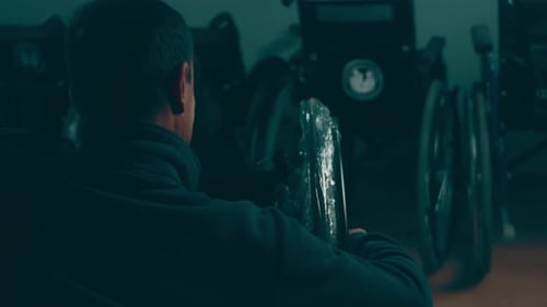 A Disabled Man Assembles a Stroller