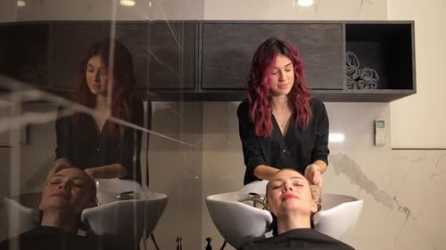 Woman Getting Hair Massage in Salon