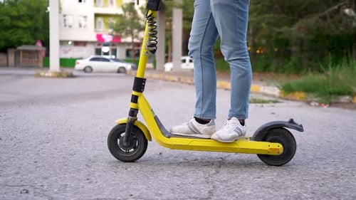 Transport of Man Riding on Electric Scooter