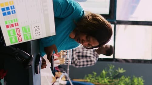 Woman Paying with Smartphone