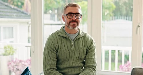 Face, smile and mature man in home for relax, peace and calm in morning on weekend break