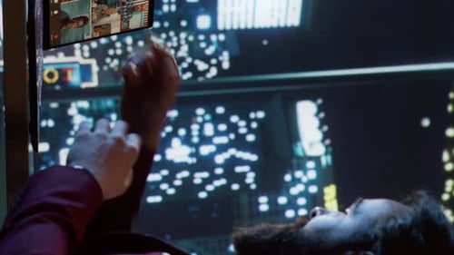 Man Lying Down Having a Video Call at Night