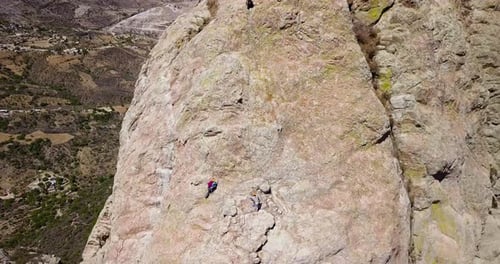 Aerial view of climbers on a rope, an extreme sport in peña de bernal, Mexico