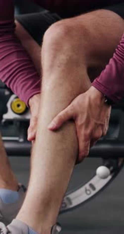 Leg injury, hands and man in gym, exercise and muscle tension with health crisis