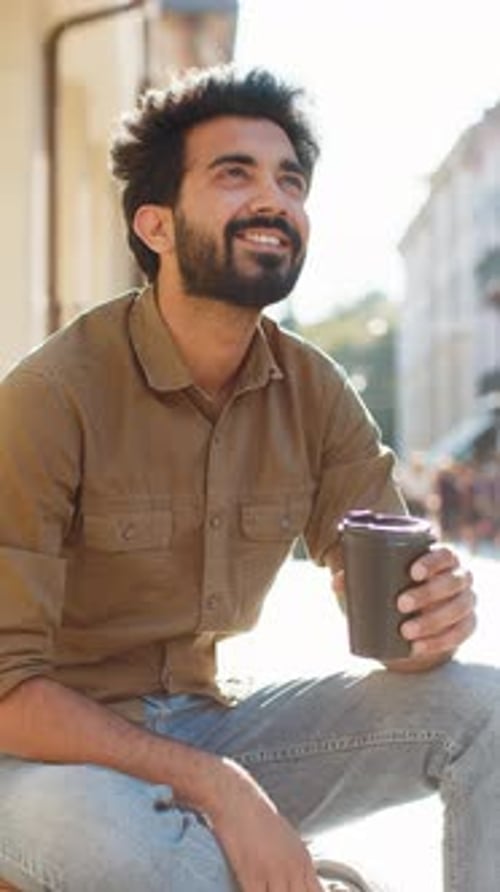 Adult Indian Man Enjoying Drinking Morning Coffee Hot Drink Relaxing Taking a Break in City Street