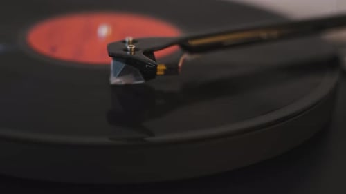 A Vinyl Record Spins in the Gramophone Music Player and Plays an Old Disco Closeup Shot of Modern