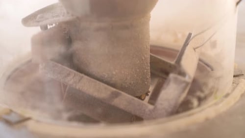 Wheat Grains Falling From Hopper To Damsel Through Shoe Of Millstone. Wheat Flour Processing. closeu