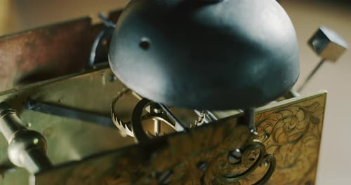 Slow motion macro close up of an old vintage clock luxury mechanism movement.