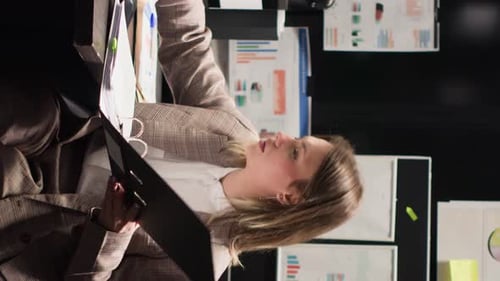 Vertical Video Investigator Enters Office with Folder