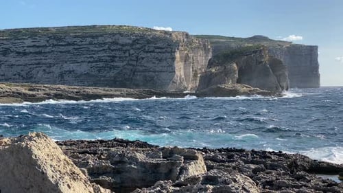 Northwest coast of Gozo, Malta with view of Fungus Rock and cliffs over Dwejra Bay