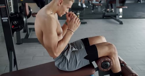 Young Man Focused on His Training Routine at the Gym