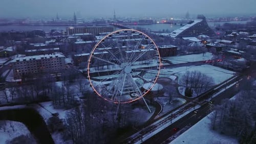 Breathtaking Snowy Aerial View of Riga Cityscape and Ferris Wheel