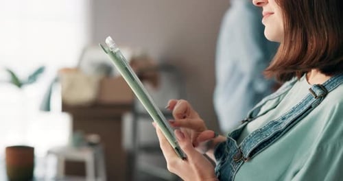 Woman Using Tablet Device Indoors