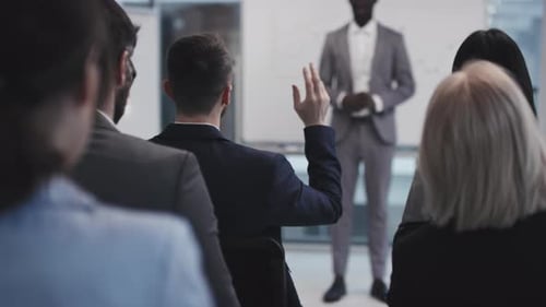 Corporate Presentation with Attendees Asking Questions