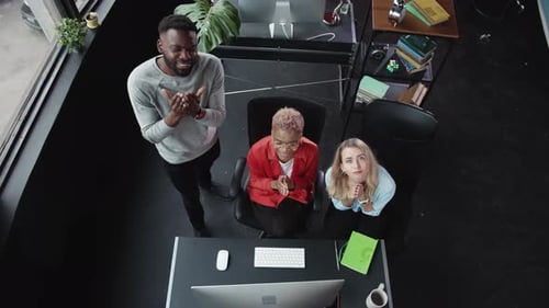 A Diverse Team of Professionals is Collaborating Effectively Within a Modern Office Environment