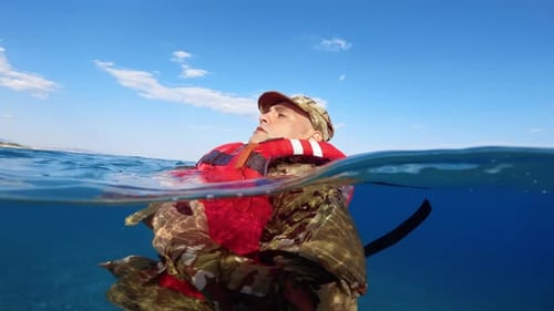 Soldier with with Life Jacket in the Ocean