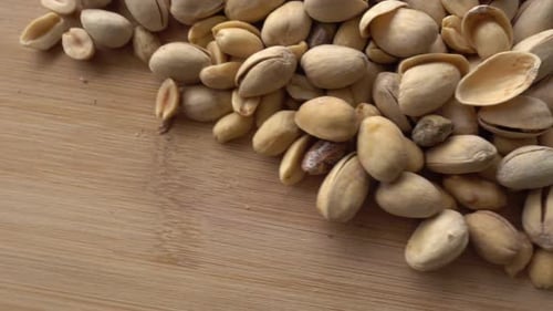 Food background. Roasted pistachio nuts seed with shell close up. Dieting concept