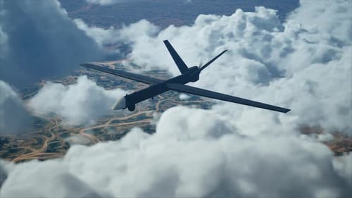 Military Drone Aircraft Flying Through Cloudy Sky