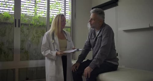 Doctor Explains Diagnosis to Concerned Male Patient