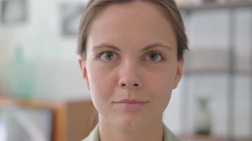 Face Close up of Smiling Young Woman at Home