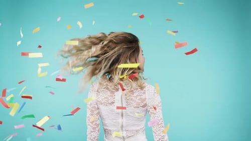 Dance, happy and woman with party confetti, celebration event and energy against a blue background