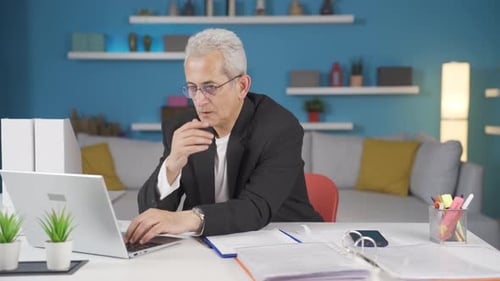 Home office worker man thinking about private life problems.