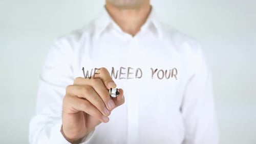 We Need Your Help Man Writing on Glass