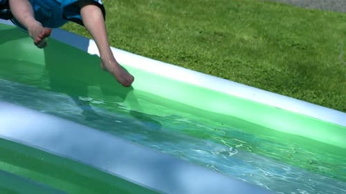 Boy Splashing Into Pool,
