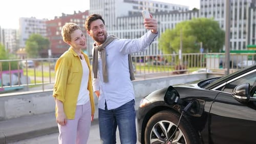 Couple Taking Selfie at EV Charger
