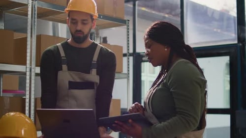 Warehouse Experts Monitoring Inventory