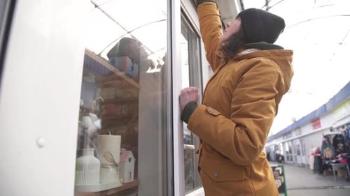 Female Business Owner of Local Store Opening Garage Storefront